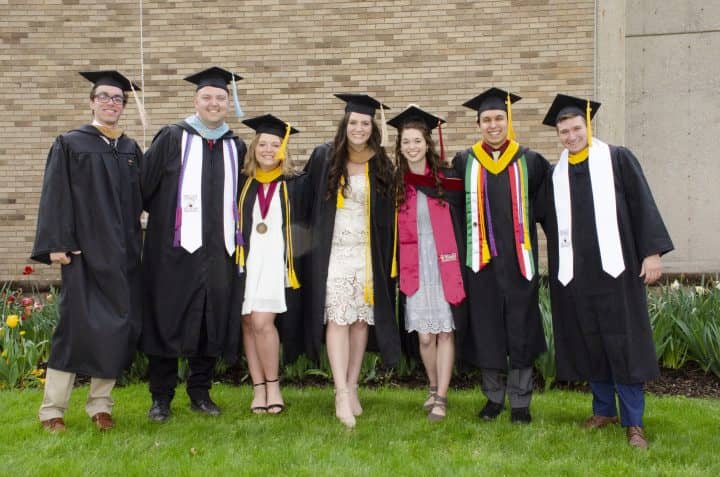walsh university students in cap and gown for graduation