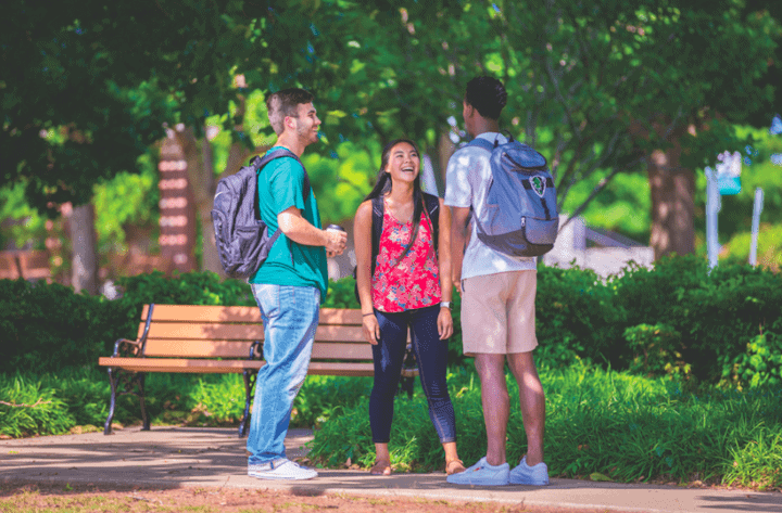 Oklahoma Baptist University students laughing on campus