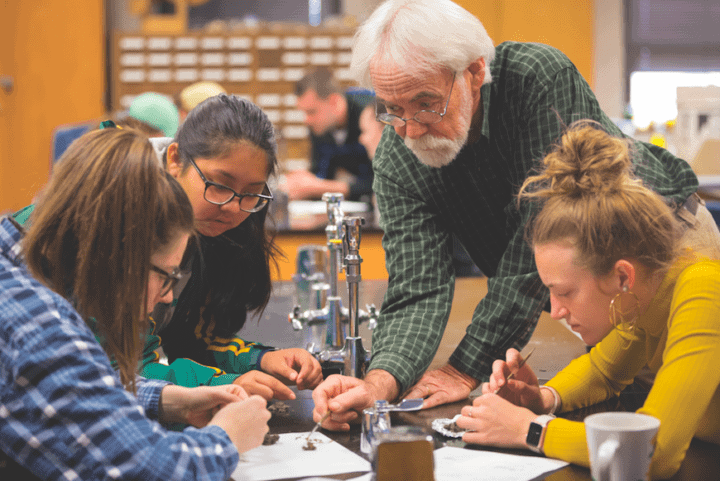 Oklahoma Baptist University biology professor guiding students through a dissection