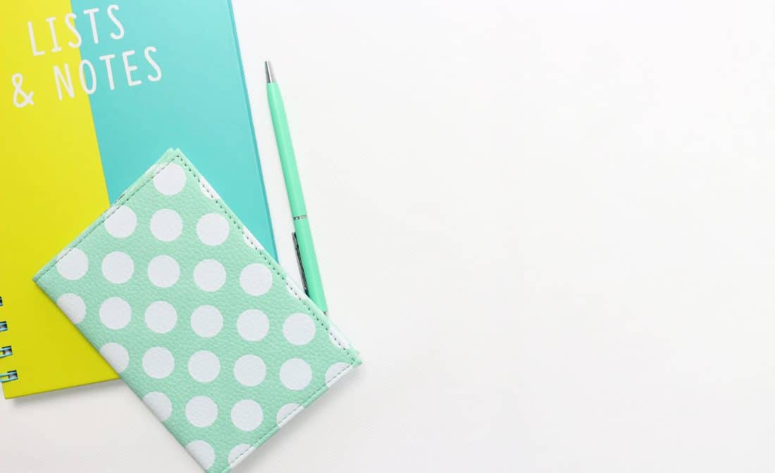 Green notebook on desk