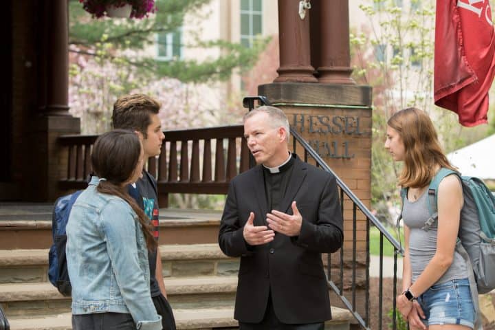 King's College with priest