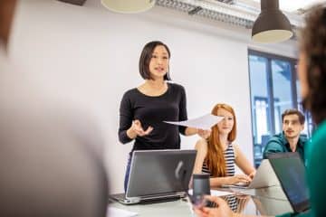 female business presenter in meeting