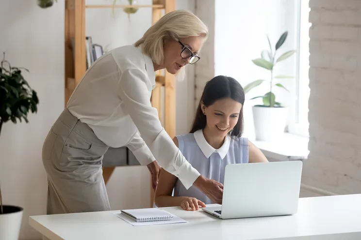 young student sitting at laptop