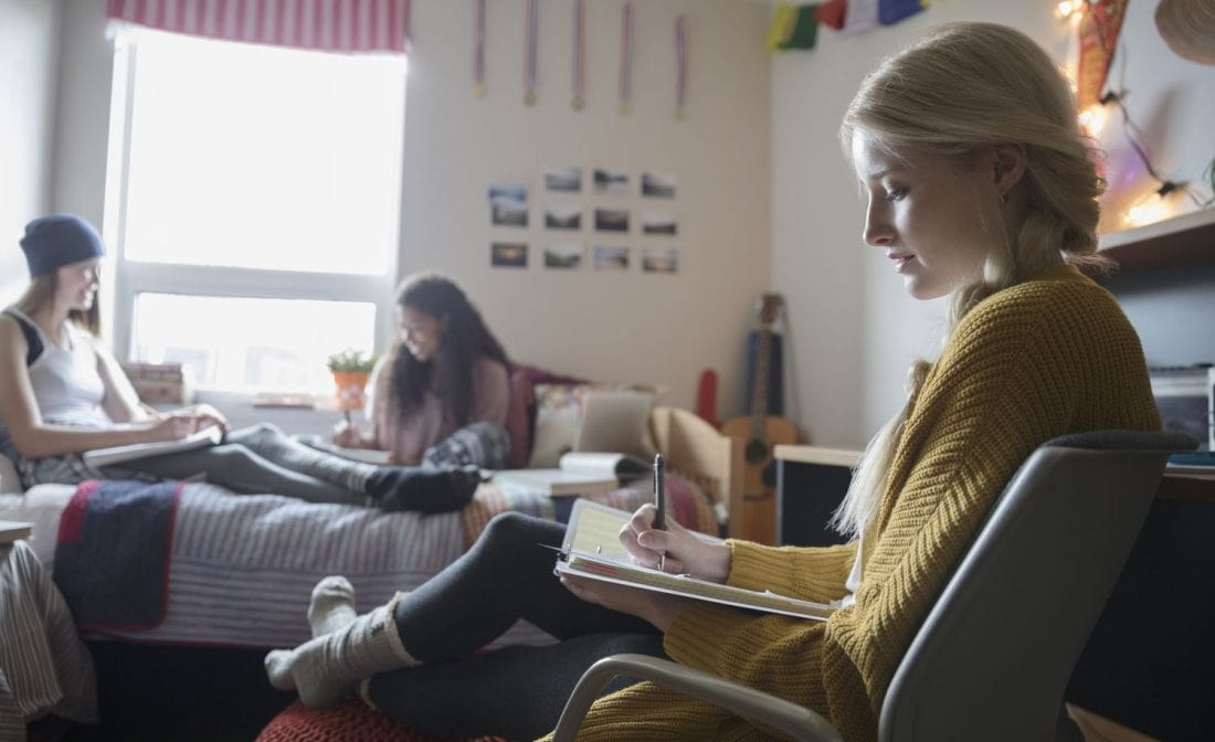 female student in college dorm